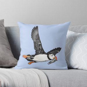 Flying puffin on a blue cushion
